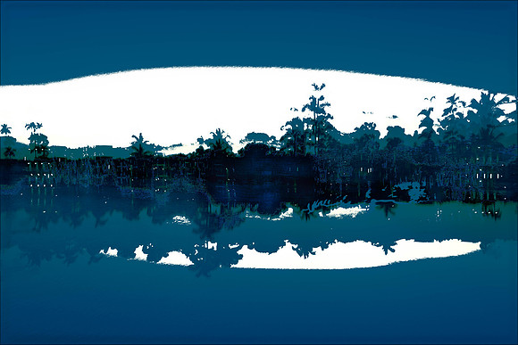 Darkness falls over the water and sky as the distant land sinks into deep shadow.