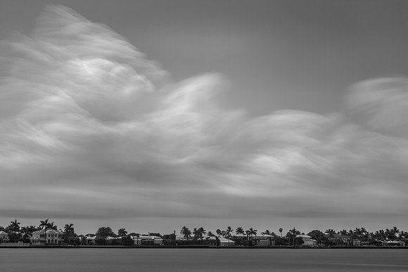 B&W image of soft, blurry clouds depicting a woman in repose