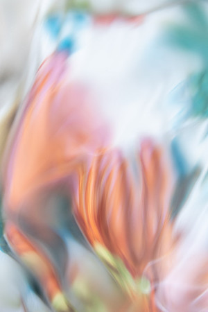 Two orange Day Lilies can be seen within the waters ripples.